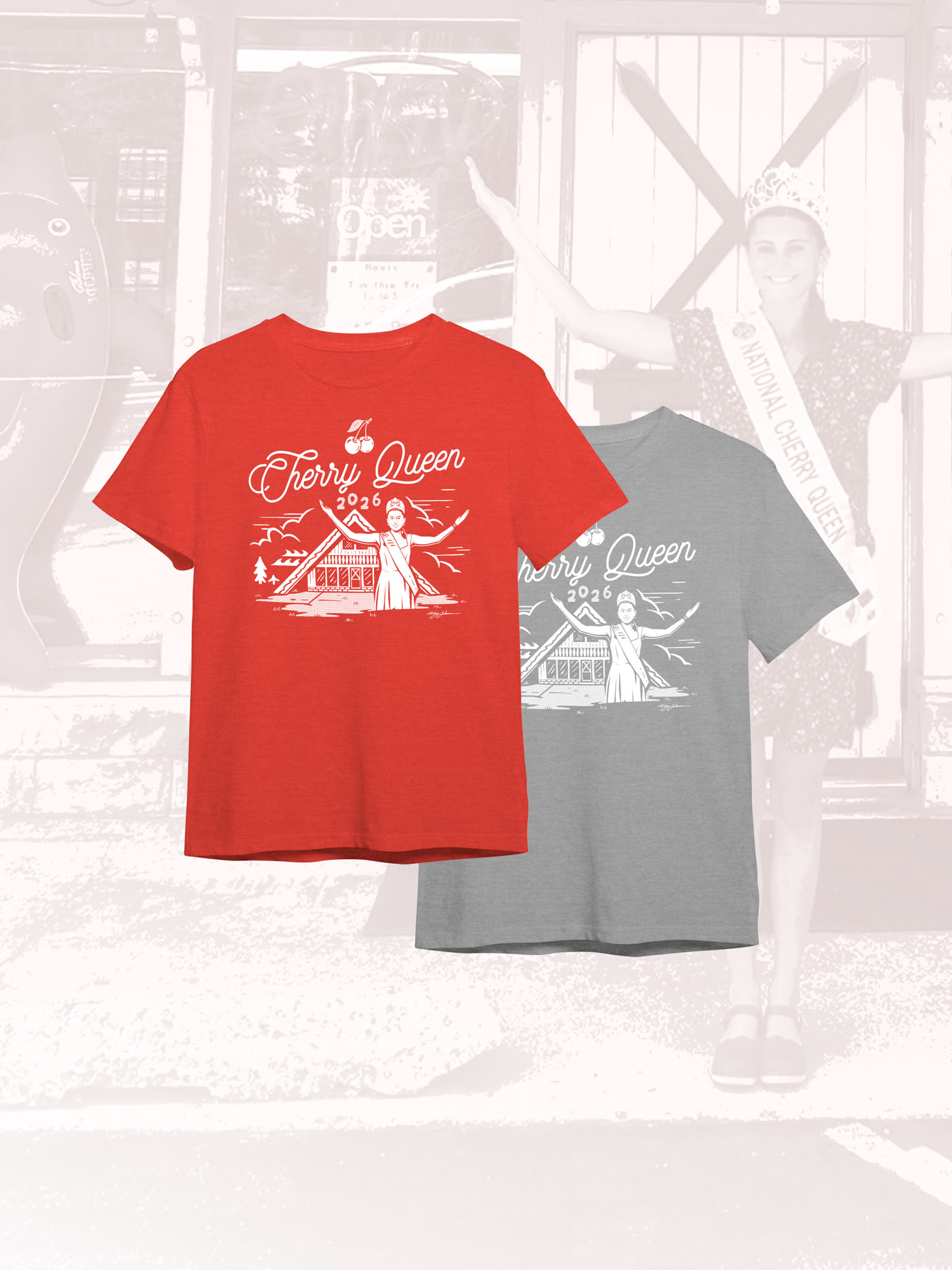 The Cherry Queen 2026 shirt in heather red and gray over a photo of Magdalen at the Don Orr storefront
