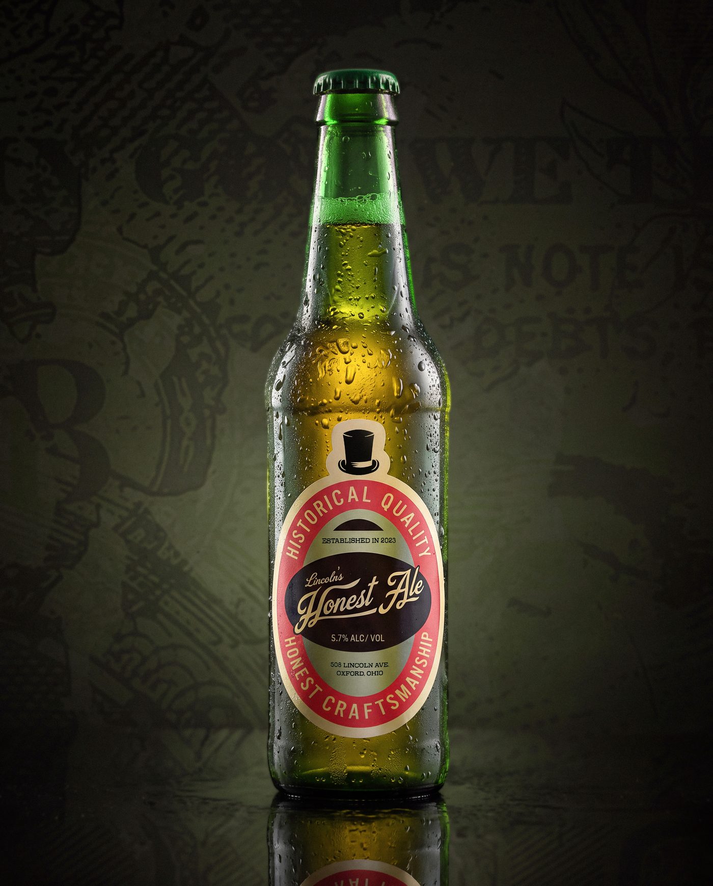 A chilled green bottle of Lincoln's Honest Ale with its Historical Quality, Honest Craftsmanship label crest, lit against a dark background