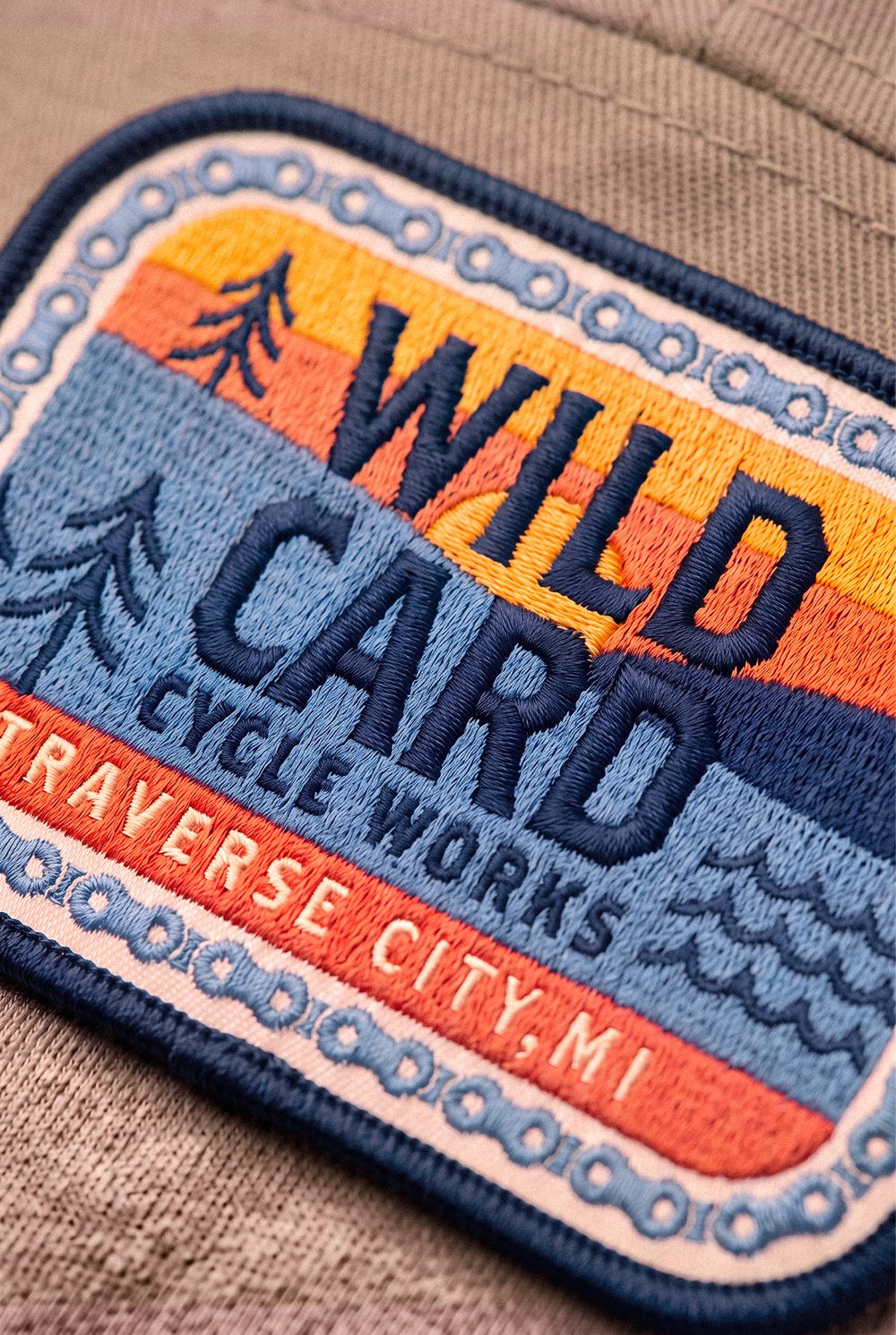 Close detail of the embroidered patch stitching, with Traverse City, MI lettered along the bottom